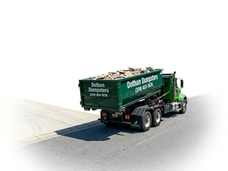 Dothan Dumpsters truck hauling away a full roll-off container in Dothan AL